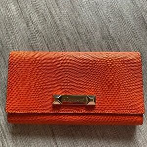 Dsquared2 bright orange long wallet in skin. Has gold tone hardware, never worn